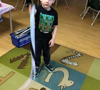 Child showing off his ribbon
