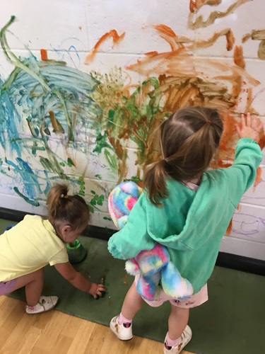 Children painting on the wall