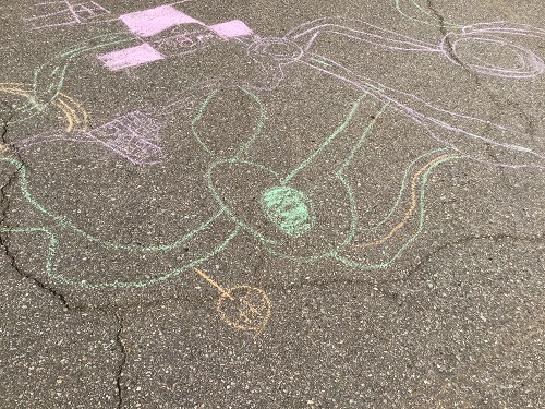 Chalk drawings on the pavement outside