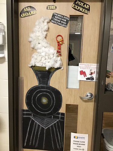 The classroom door decorated with a train