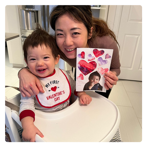 Christel Wu with her son in a highchair in the kitchen
