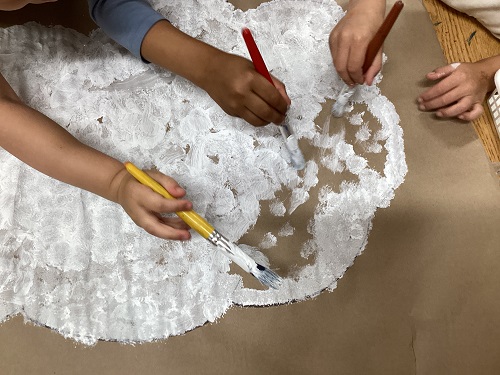 A school age child working on an art project