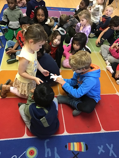 Child letting others touch her show and share 