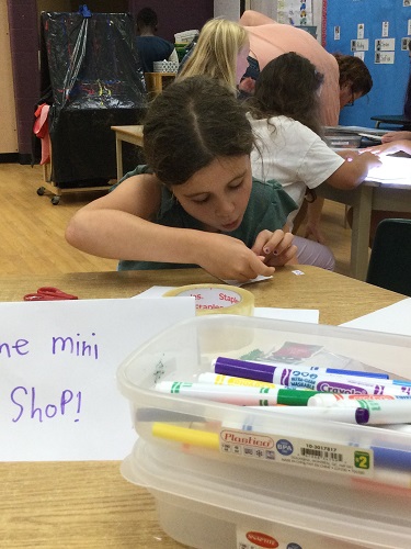 school-age girl making a Mini shop