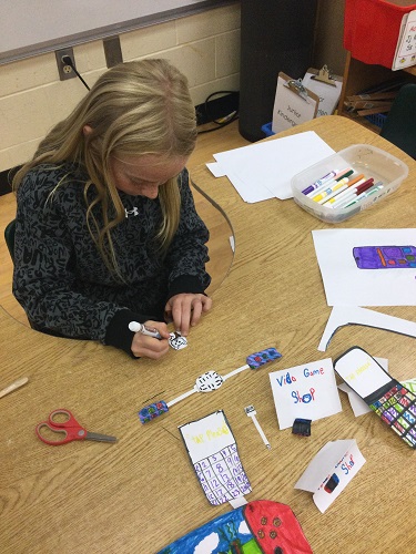 school-age girl making a video game store 