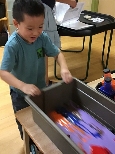 JKK boy exploring marble painting 