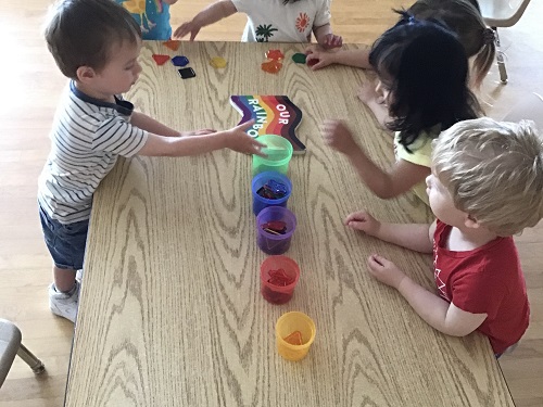Toddlers sorting colours