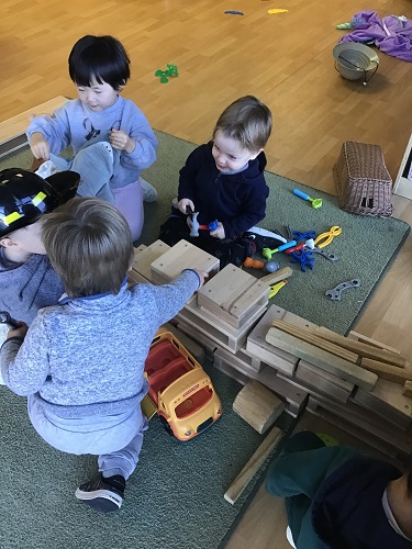 Preschool children constructing pirate ship from blocks