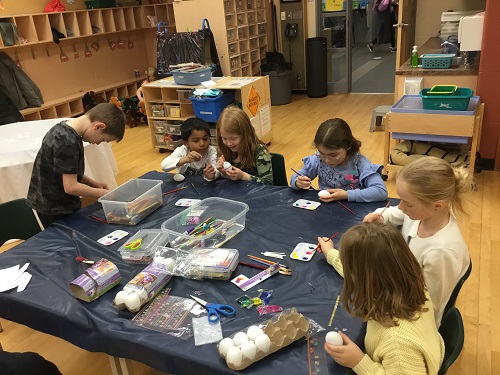Group of school-age children creating art