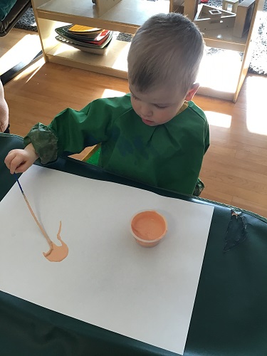 Child painting with string