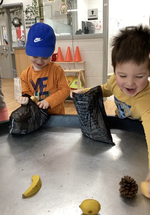 Children collecting pretend garbage.