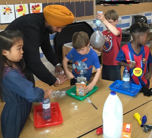 School age children participating in a science experience