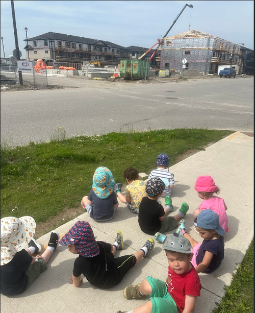 A group of children observing the construction