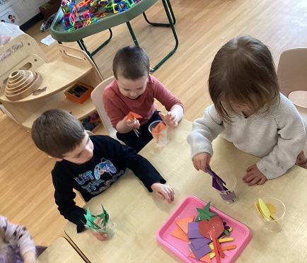 Preschool children looking at various shapes