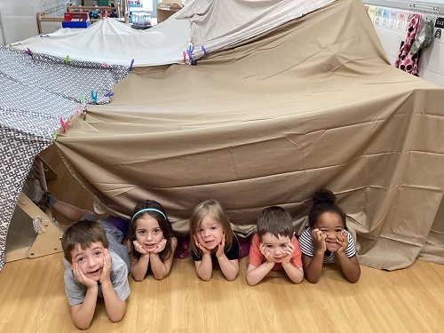 preschool children inside a fort