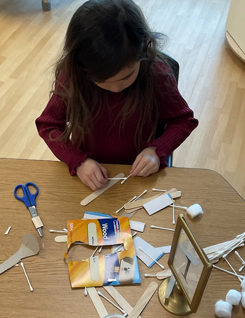 child with qtips and sticks