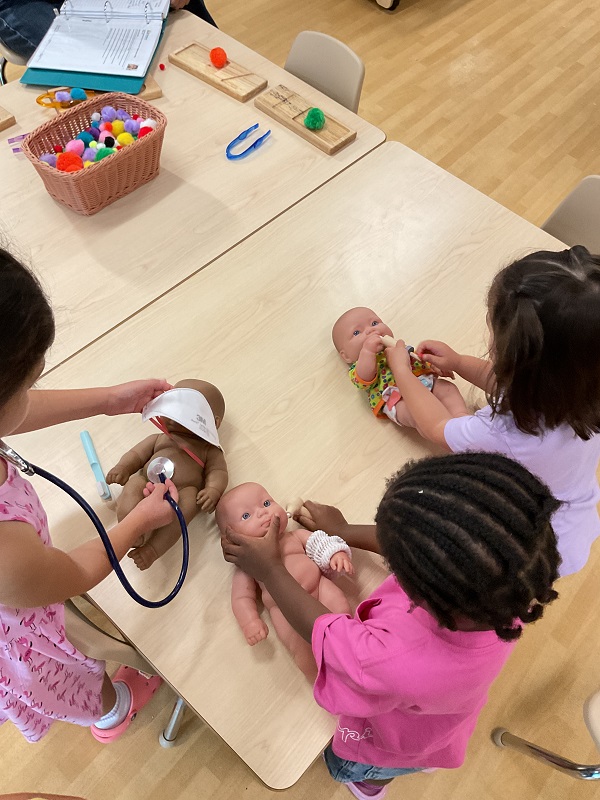 3 children performing check ups