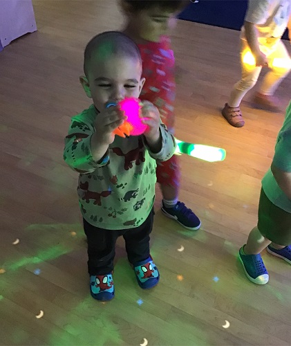 A child holding a light stick