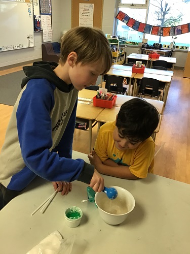 Children mixing bubble solution