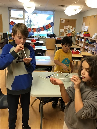 Children blowing bubbles