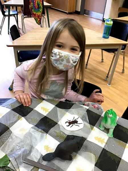 masked girl making a homemade foccil