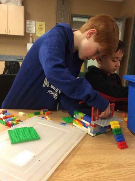 older boys playing with lego