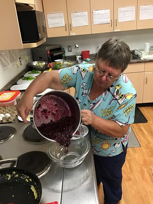 The cook heating up the berries