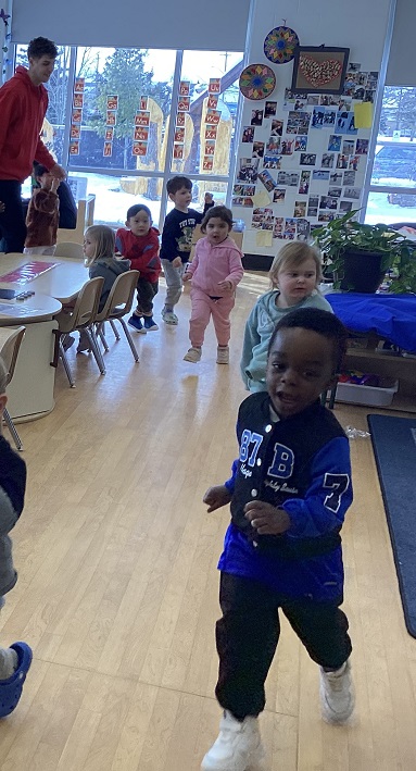 children walking around the classroom