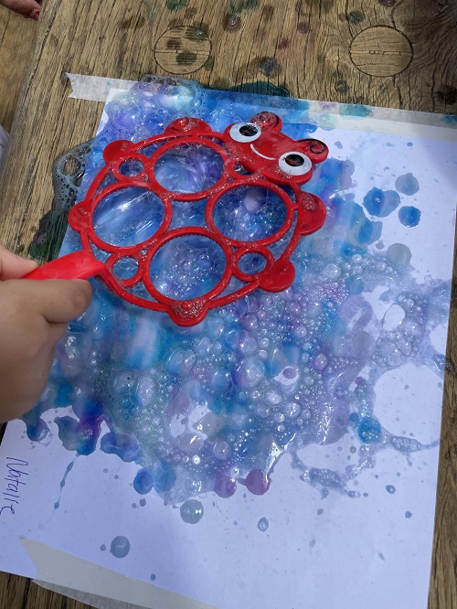 red wand blue bubbles