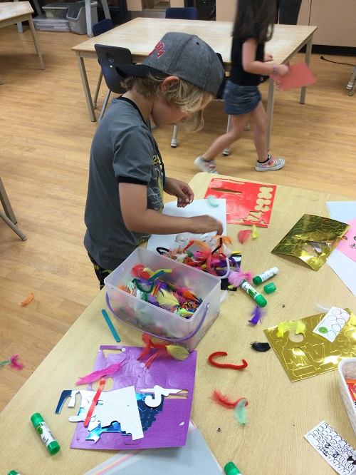 child with craft materials