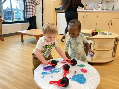 The infants at RisingOaks Early Learning | St. Patrick explored colors, textures, and movement through a bubble wrap painting activity. Using rollers, hands, and curiosity, they discovered different ways to interact with the materials while sharing space.