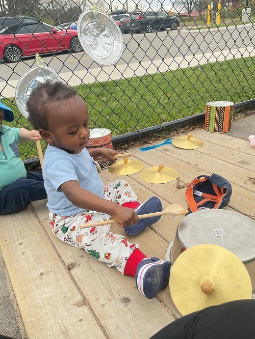 Clang Clang Rattle Bing Bang, where the sounds heard across the playground as the infants drum session commenced at RisingOaks Early Learning | St. Patrick 