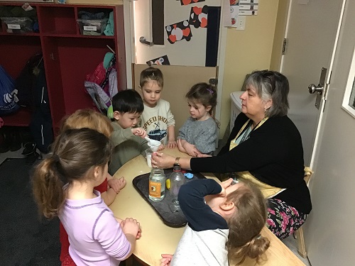 teacher leading an experiment