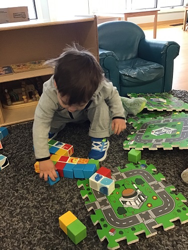 child playing with toy