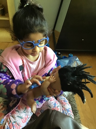 Asal taking the babies temperature 