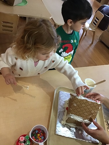 child reaching for object