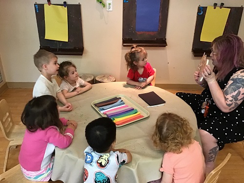 A group of children sitting at a table