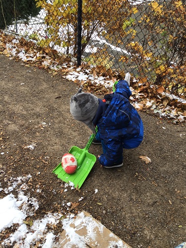 child using shovel