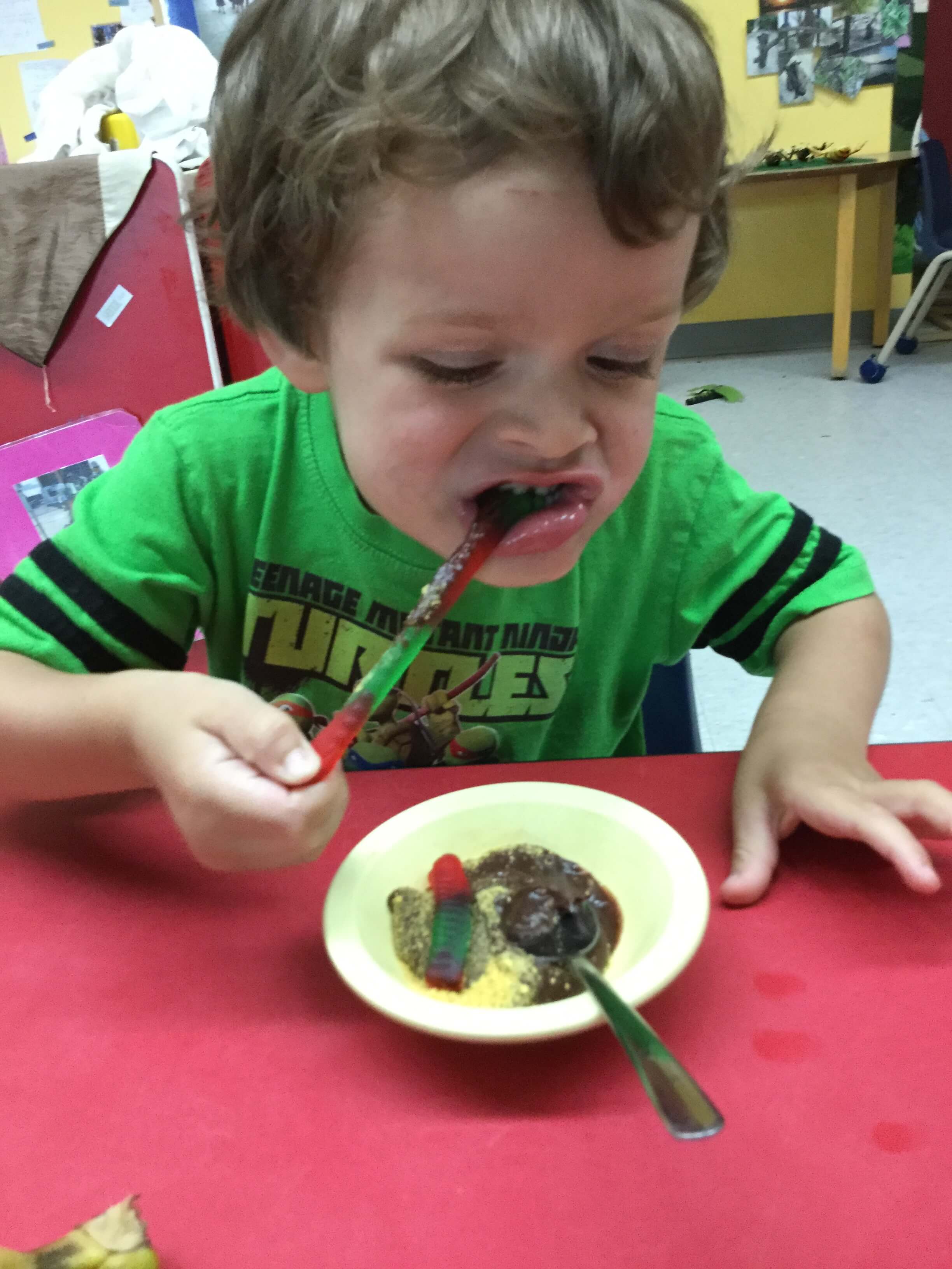 boy eating gummy worms
