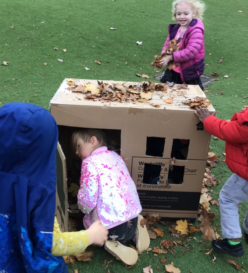 Child going into the box shaped as a house