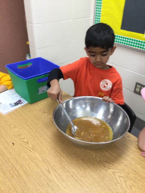 Child mixing ingredients