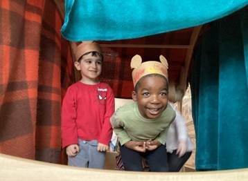 children wearing construction paper bear hats