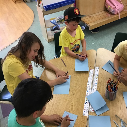 Children making cards together.