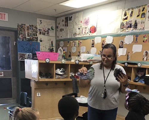 Educator showing purple cabbage to group