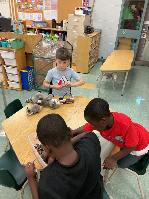 Children playing together at a table.