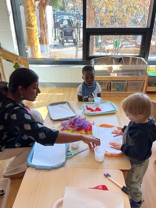 Educator and 2 children at the table