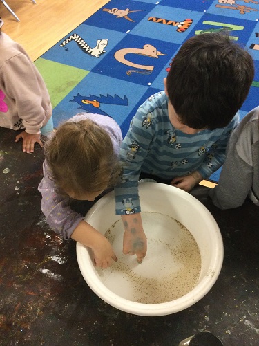 Children using dish soap to make pepper move away from their fingers