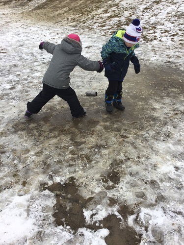 Children slidding on the ice