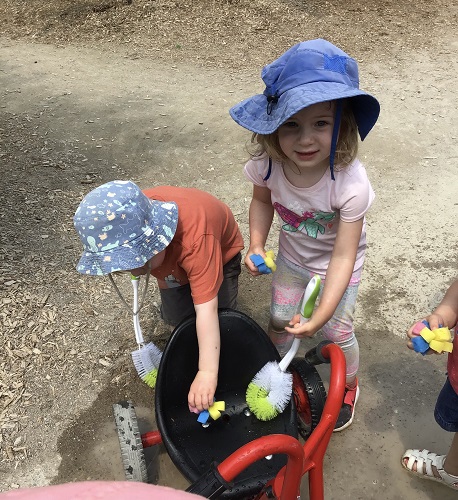 Children washing bikes