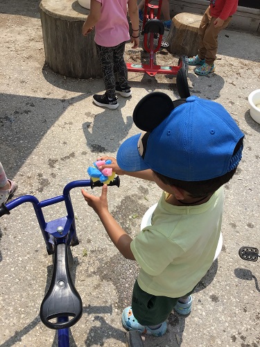 A child washing a bike
